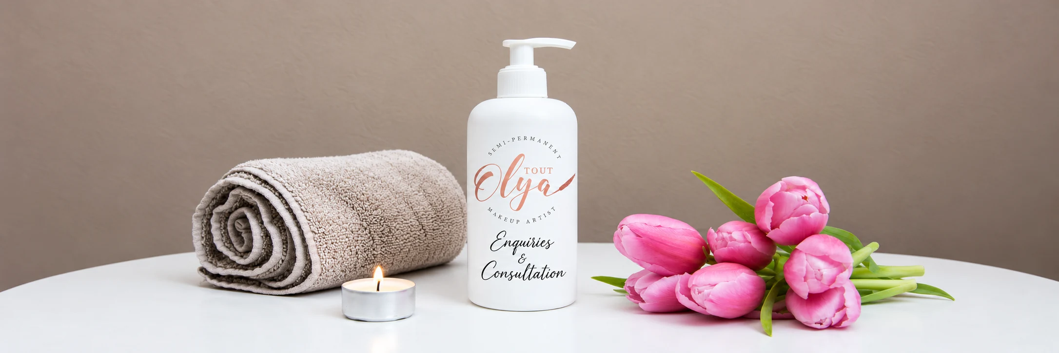 Olya Enquiries & Consultation banner with a labelled bottle, towel, candle and pink tulips.