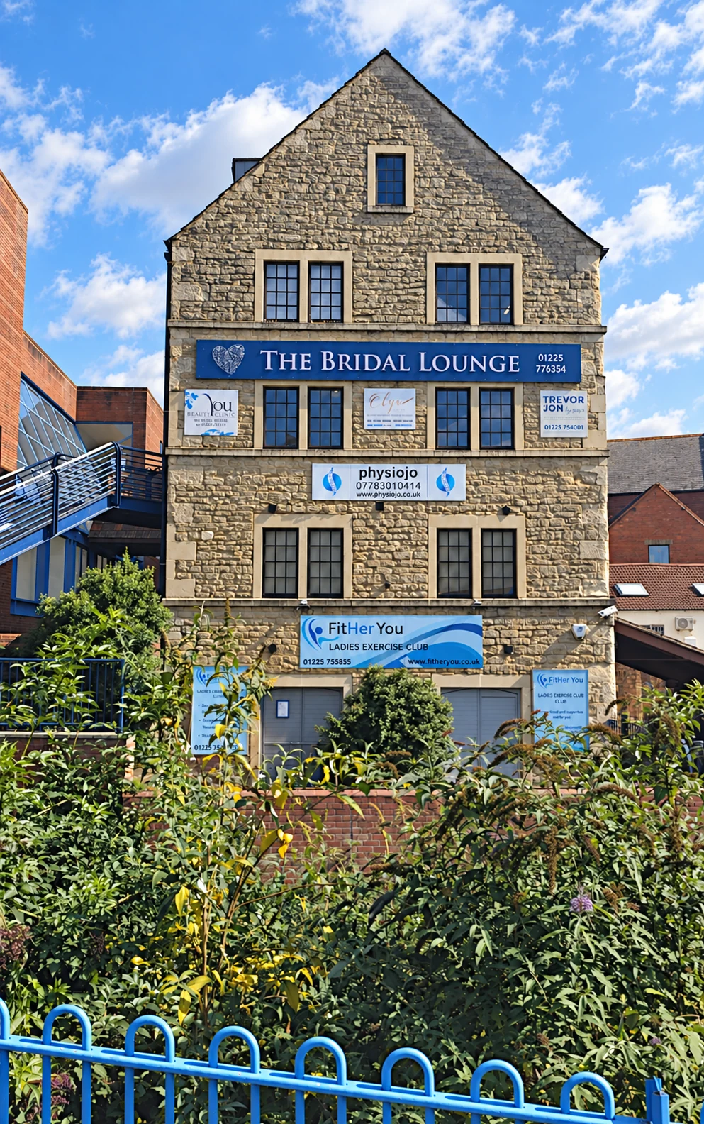 Stone Mill building exterior with Olya’s clinic signage at the Shires Shopping Centre in Trowbridge.